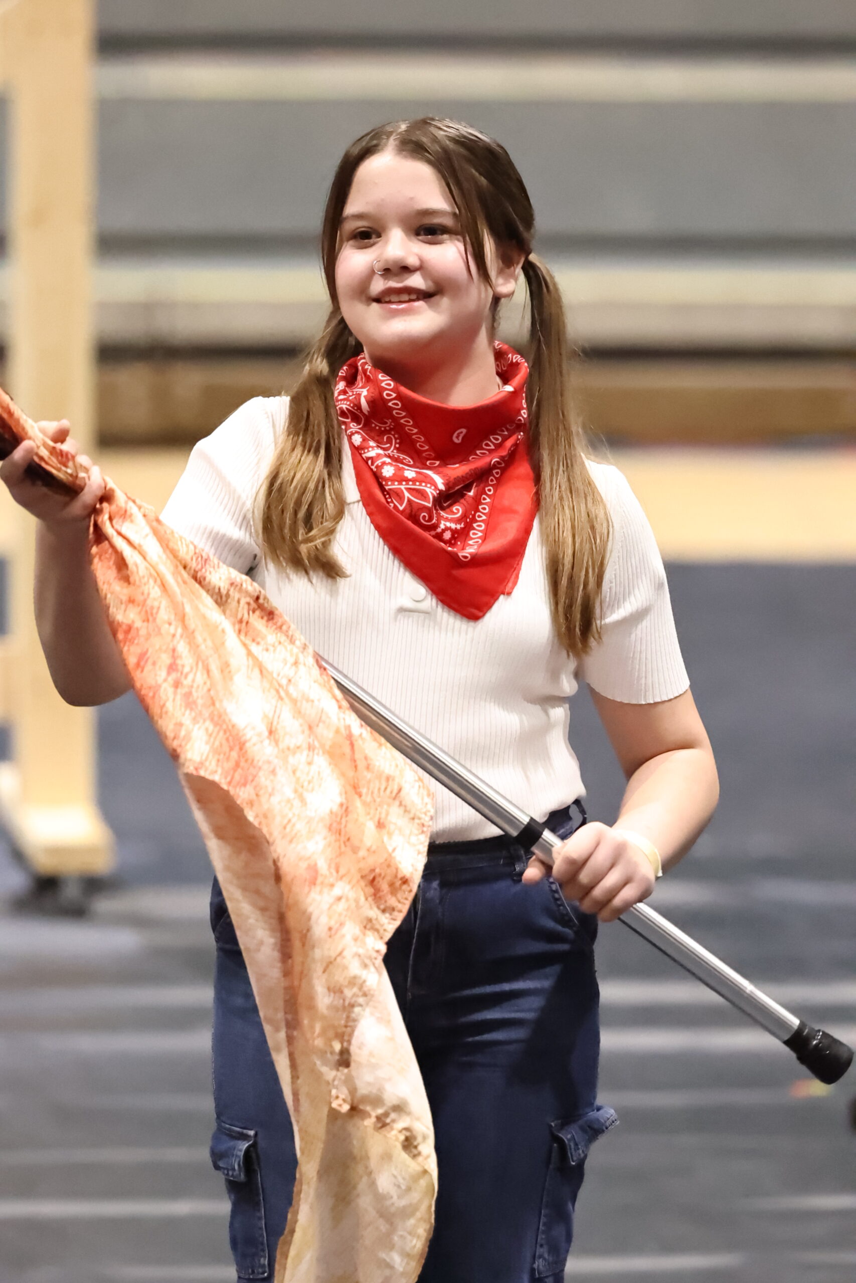 Belding Cadets winter guard member smiling mid-performance