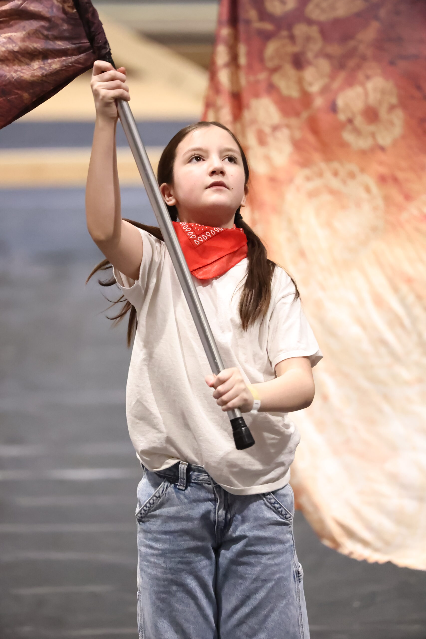 Belding Cadets winter guard member performing with a flag